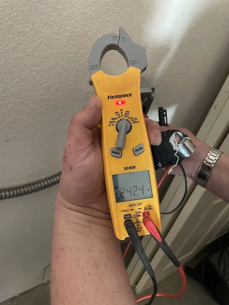 Voltage testing with clamp meter during Outlet Installation in Centerville